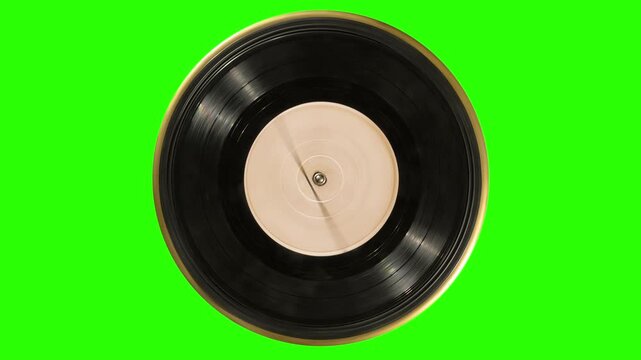 Old dirty black vinyl record with a blank orange label spins on the turntable platter. On green chroma key. Looped motion with alpha matte