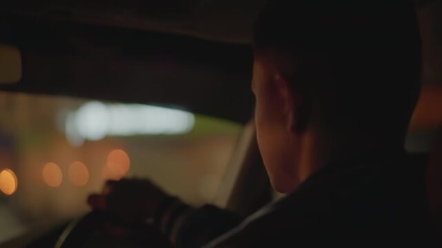 night car interior rear view driver navigating neon streets, hands on wheel, dashboard glow, reflective mood, rideshare operator, taxi driver, latenight courier, silent commute, cinematic bokeh,