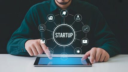 Man interacting with startup icons on tablet screen