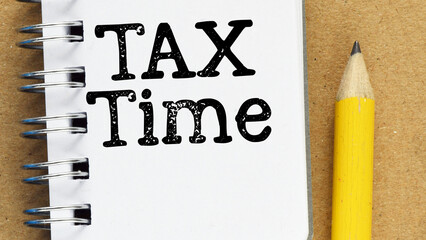 TAX TIME words in an office notebook.