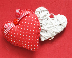 Red and white hearts on a red background..