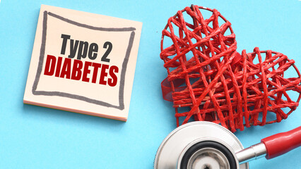 Type 2 diabetes words on a piece of paper next to a stethoscope.