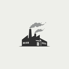 Obraz premium Industrial factory with smoke stacks in urban setting