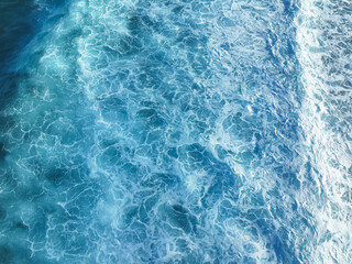 Aerial view of the turquoise ocean water swirling in mesmerizing patterns, creating a breathtaking spectacle of nature's artistry, Thulusdhoo, Kaafu Atoll, Maldives.