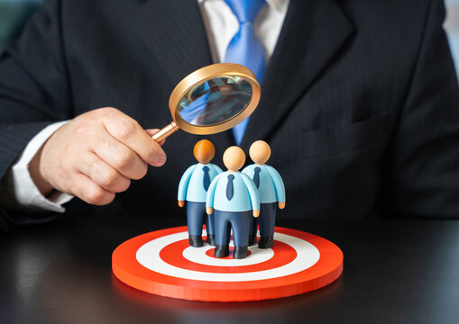 A businessman studies his target audience of office workers and clerks. Evaluating effectiveness and feedback. Market research, consumer behavior analysis and business optimization