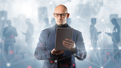 Business professional uses tablet with digital network and market data overlay, representing data-driven decision making, financial analysis and corporate technology.