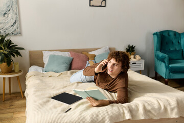 Curly teenager relaxed in bedroom while talking on phone with friends after school