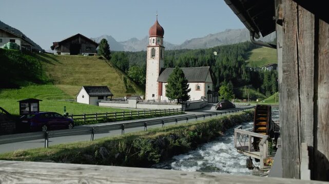 Cityscape Otztal Umhausen Austria. Historic church in alpine mountains landscape, tourist europe.