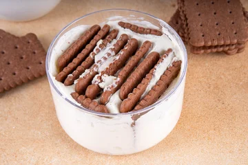 Fototapete Zu Essen Simple two ingredient yogurt cheesecake in glass, viral tasty quick recipe made with greek yogurt and chocolate biscuits, copy space  © ricka_kinamoto