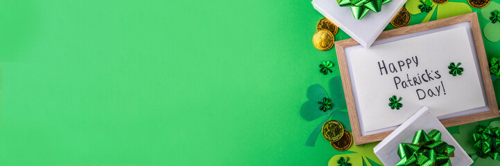 Shamrock saint patrick's day bright high-colored background, St. Patrick's holiday flatlay with party gift boxes, decor, shamrock and gold coins on green background