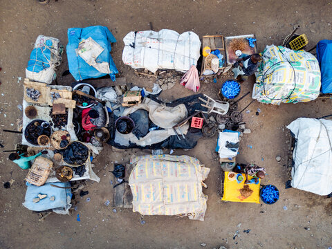 Aerial view of a bustling Lagos Street market scene where vibrant colors and textures of goods create a lively mosaic, Kaduna, Kaduna, Nigeria.