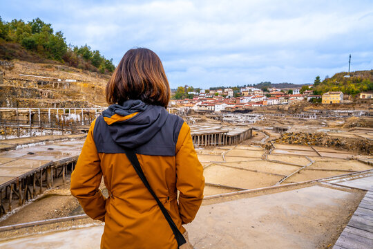 Woman exploring anana salt valley salt flats landscape