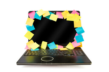 Colorful sticky notes on a laptop screen edge frame, many reminders for things to do, abstract burnout concept