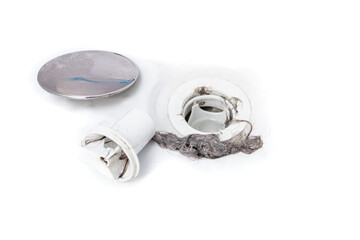 Pulling hair from a clogged shower drain isolated on white background, soft focus close up