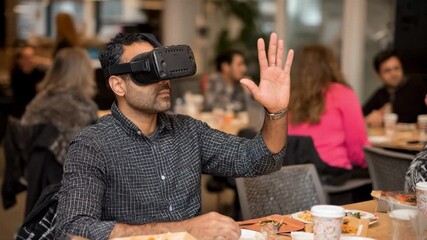Closeup medium shot of a participant exploring immersive tax code challenges within a virtual reality educational platform for skill development.