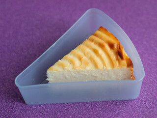 Classic Creamy Cheesecake Slice Served on Purple Surface