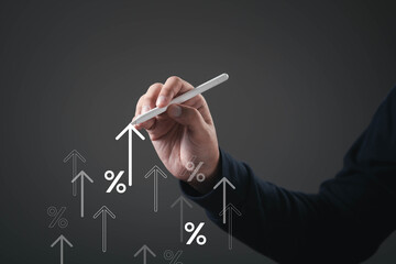 Business professional drawing upward arrow and percentage symbol with digital pen, representing financial growth, profit increase, rising performance, investment, rate improvement, positive results.