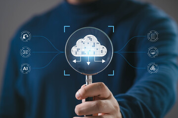 Magnifying glass highlighting cloud computing technology, representing data management, cloud storage, AI integration, digital transformation, system automation, and modern business infrastructure.
