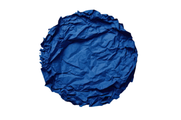 Close-up of a ball of crumpled blue paper against a stark black background