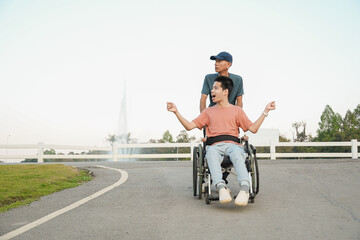 A joyful outdoor lifestyle moment of a young wheelchair user enjoying fresh air in a park with supportive family. Natural light scene expressing freedom, confidence, and inclusive everyday living.