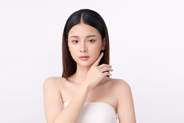 A beautiful young Asian woman with clean, fresh skin against a white background. Skincare, facial treatment, cosmetology, beauty, and spa. An elegant portrait of an Asian woman.