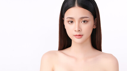 A beautiful young Asian woman with clean, fresh skin against a white background. Skincare, facial treatment, cosmetology, beauty, and spa. An elegant portrait of an Asian woman.