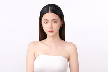 A beautiful young Asian woman with clean, fresh skin against a white background. Skincare, facial treatment, cosmetology, beauty, and spa. An elegant portrait of an Asian woman.