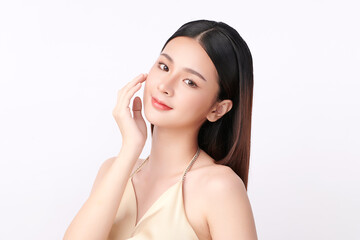 A beautiful young Asian woman with clean, fresh skin against a white background. Skincare, facial treatment, cosmetology, beauty, and spa. An elegant portrait of an Asian woman.