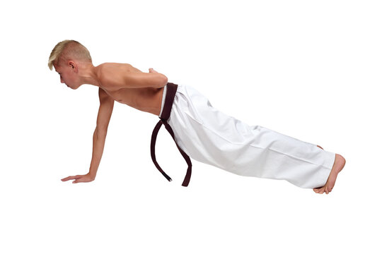 Fit man performing push-up exercise with straight body posture