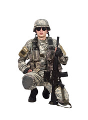 Armed soldier in full combat gear standing