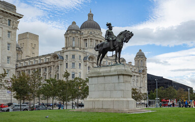 Liverpool, united kingdom May, 16, 2023 Edward VII Statue On Horseback In Front Of Liverpools famous liver building, three graces