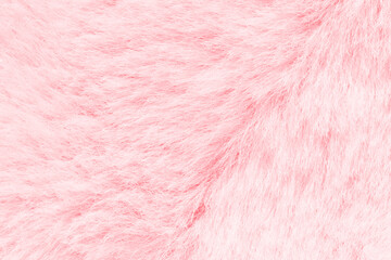 Soft pink fluffy texture close-up of plush surface for cozy and warm design elements.