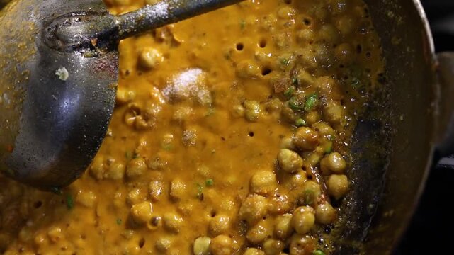 Chole masala or chana spicy curry eaten with bhature or kulcha