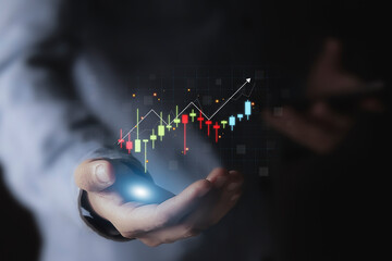 Developing a business strategy plan Business owners hold a chart showing business growth