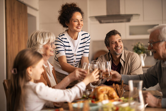 Multi-generational family celebrating a holiday dinner together at home