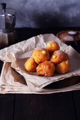 Carnival brighelle or fried cream puffs with custard