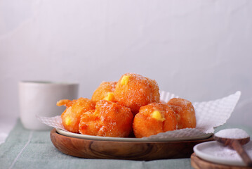 Carnival brighelle or fried cream puffs with custard