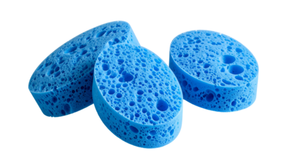 Three blue porous cosmetic sponges on a black background, close-up with good depth of field