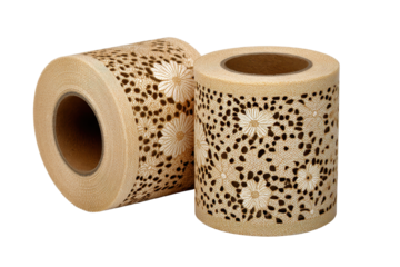 Two beige lace pattern adhesive tape rolls with perforated floral cutouts, neat cylindrical coils, delicate paper texture and decorative crafting style isolated on transparent background.