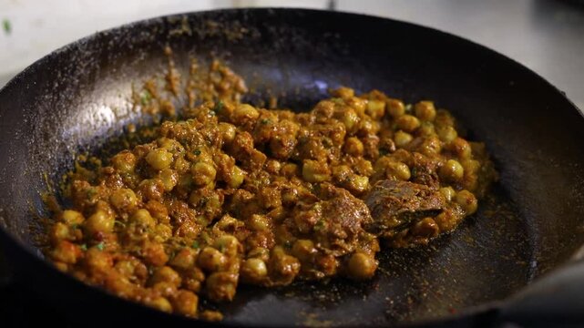 Chole masala or chana spicy curry eaten with bhature or kulcha