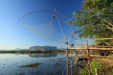 Fishing equipment with the view of Nong Samor lake and Phu Pha Man mountain as a backdrop.
Phu Pha Man ,Khon Kaen,THAILAND