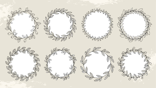 Large set of eight unique hand drawn laurel wreaths and circular floral frames in a sketchy black and white style for classic logo designs.