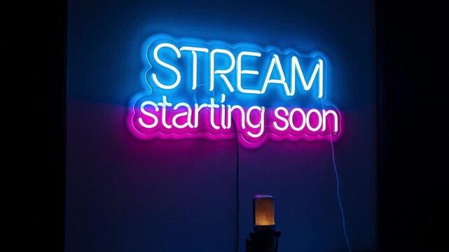 Neon sign says Stream starting soon in dark room
