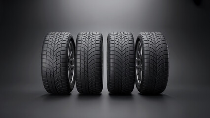 Set of Four New Car Tires Standing in Row on Dark Grey Studio Background for Automotive Safety