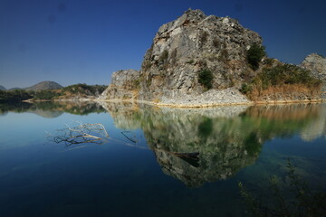 Blue Lagoon ,a large emerald-blue pond surrounded by limestone mountains. It is 70 meters deep and was created by releasing water after the stone mill stopped  mining. 
Phu Pha Man ,Khon Kaen,THAILAND