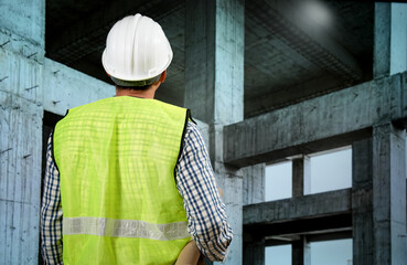 Civil engineers inspect building construction projects, checking the structural integrity and safety measures.