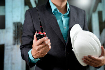 Civil engineers inspect building construction projects, checking the structural integrity and safety measures.