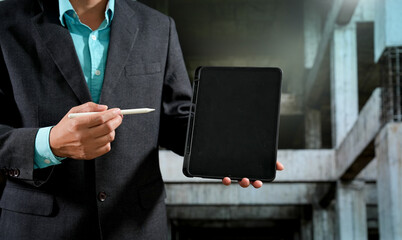 Civil engineers inspect building construction projects, checking the structural integrity and safety measures.