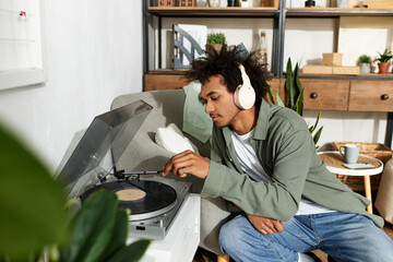 Joyful moments of a young man enjoying music in a cozy modern home
