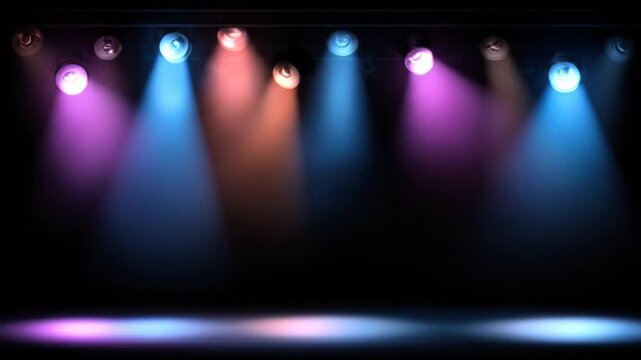 Stage lighting with colored spotlights on a black background